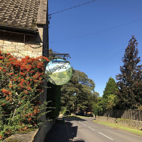 Image of a road and Inn sign