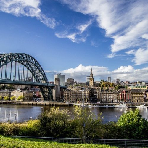 Image of a river and bridge with cityscape